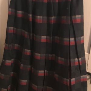 Pleated plaid wool skirt with genuine snake belt.